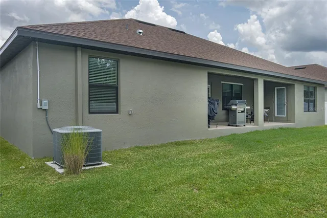 a view of an house with backyard space and garden