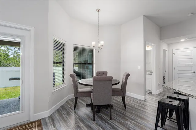 a dining room with furniture window wooden floor
