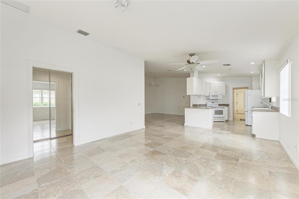 6073 Erice Street Venice, FL 34293 - Photo 23 of 71 a view of a kitchen with kitchen island and stainless steel appliances
