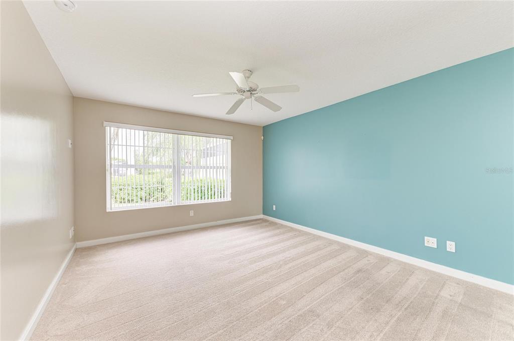 6073 Erice Street Venice, FL 34293 - Photo 26 of 71 an empty room with a window and a fan