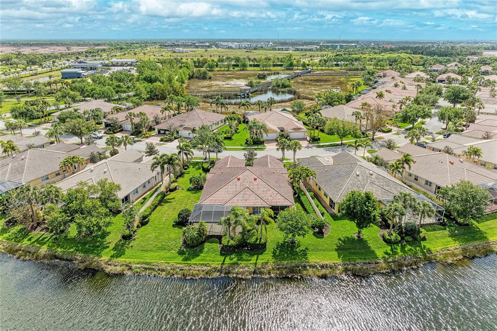 6073 Erice Street Venice, FL 34293 - Photo 52 of 71 an aerial view of a house with a yard