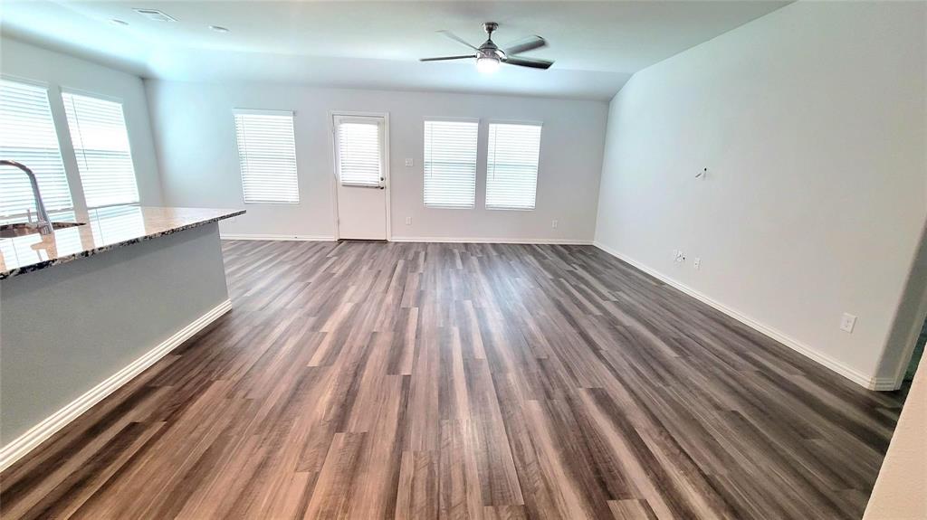 263 Sunshine Lane Lavon, TX 75166 - Photo 11 of 27 wooden floor in an empty room with a window