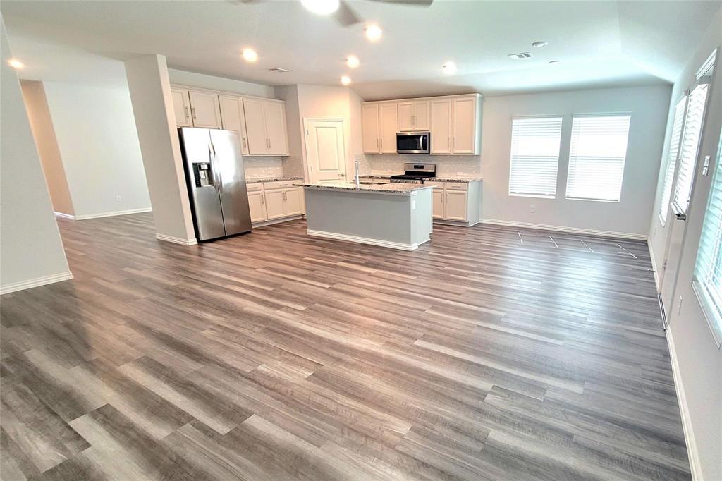 263 Sunshine Lane Lavon, TX 75166 - Photo 27 of 27 a view of kitchen view wooden floor and stainless steel appliances