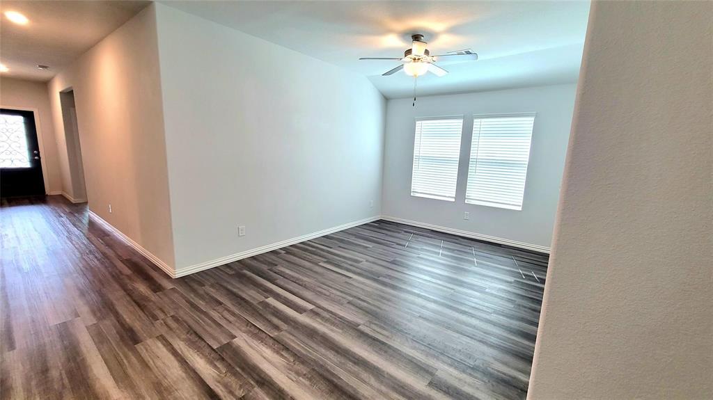 263 Sunshine Lane Lavon, TX 75166 - Photo 18 of 27 a view of empty room with wooden floor and fan