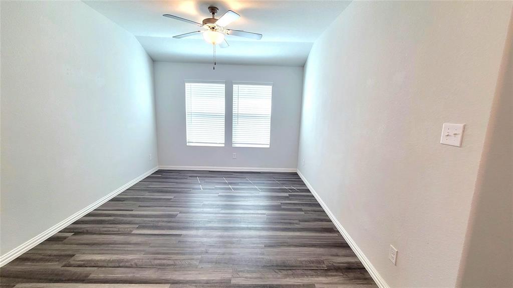 263 Sunshine Lane Lavon, TX 75166 - Photo 19 of 27 a view of an empty room with wooden floor and fan