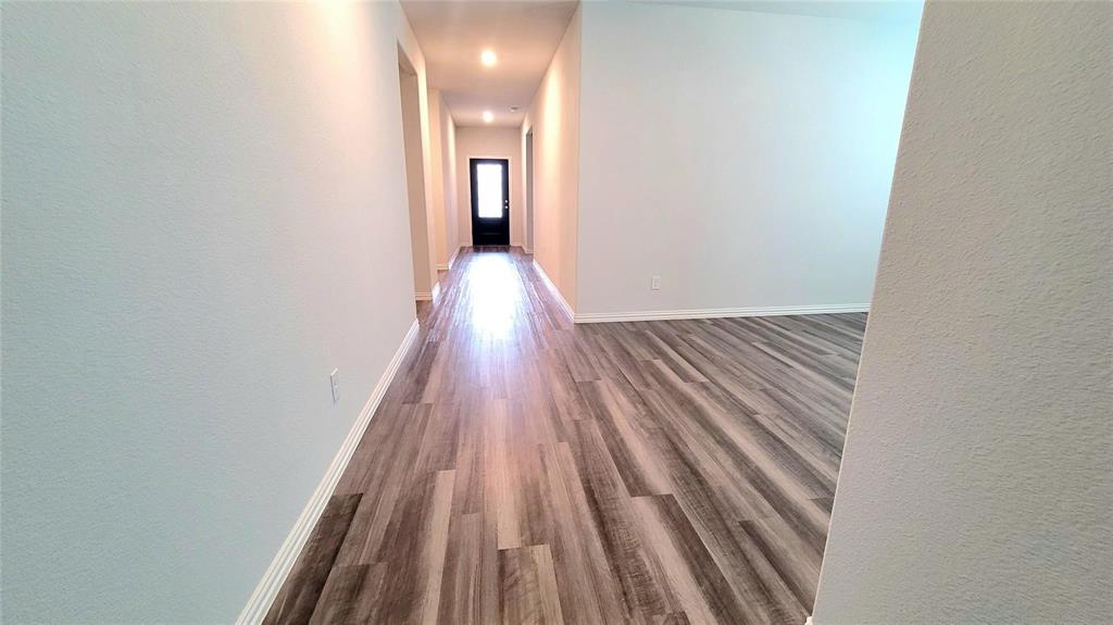 263 Sunshine Lane Lavon, TX 75166 - Photo 22 of 27 a view of a room with wooden floor