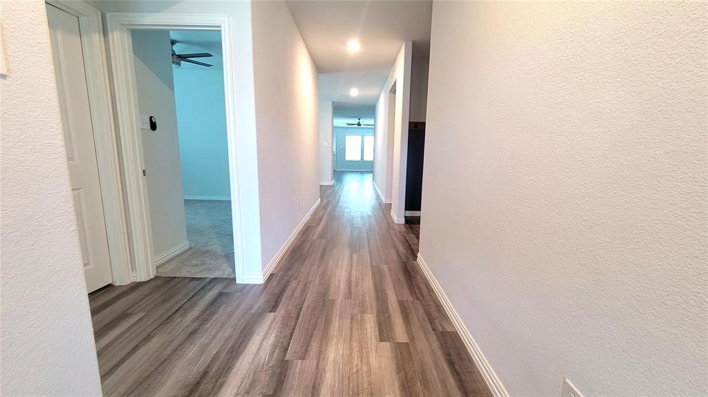 263 Sunshine Lane Lavon, TX 75166 - Photo 24 of 27 a view of a hallway with wooden floor