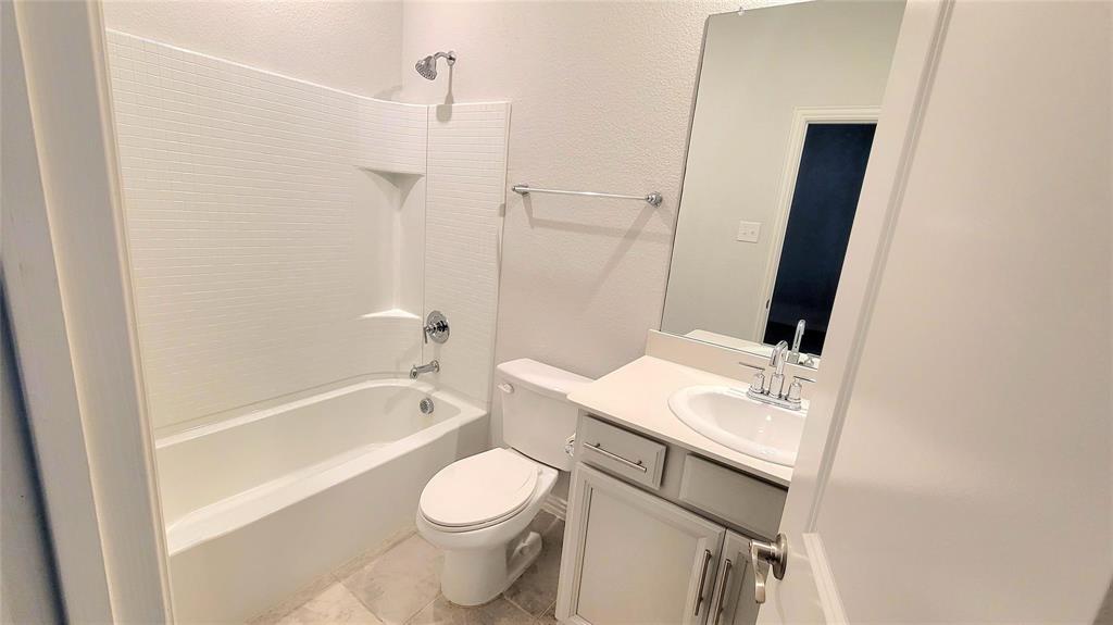 263 Sunshine Lane Lavon, TX 75166 - Photo 8 of 27 a bathroom with a sink a toilet and shower