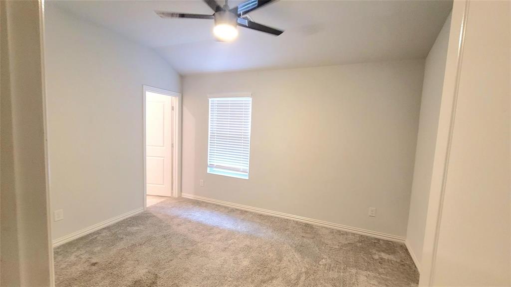 263 Sunshine Lane Lavon, TX 75166 - Photo 9 of 27 an empty room with a window and a fan