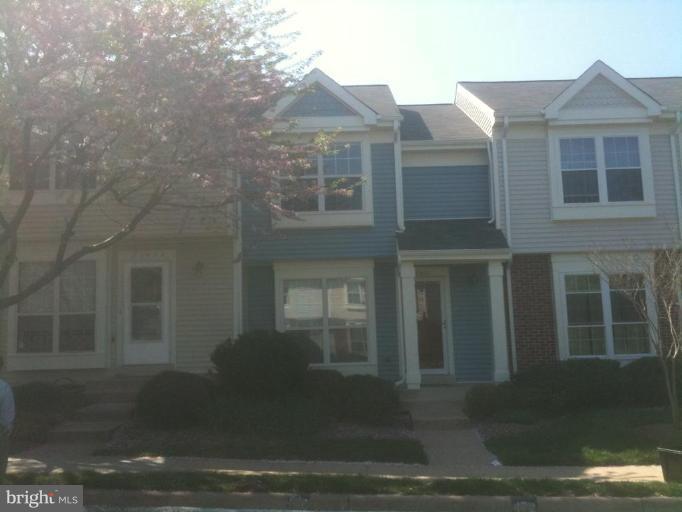 21673 Hazelnut Square, Unit 172 Sterling, VA 20164 - Photo 11 of 15 a front view of a house with yard