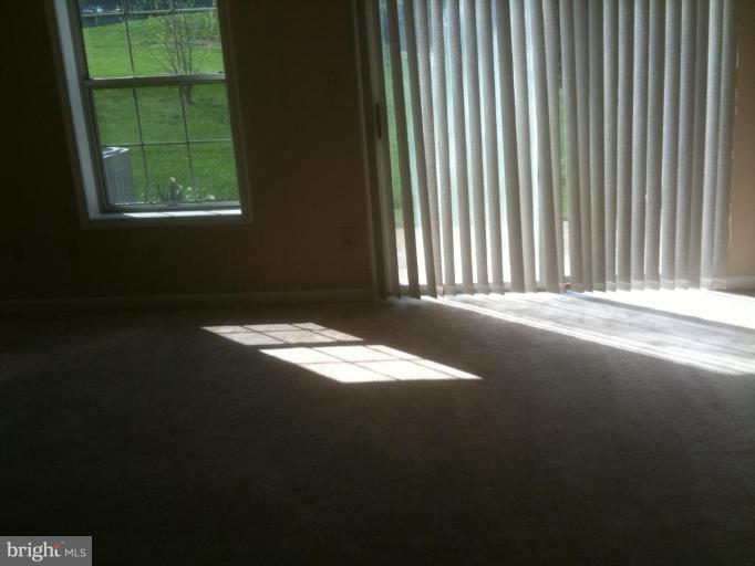 21673 Hazelnut Square, Unit 172 Sterling, VA 20164 - Photo 13 of 15 a view of an empty room with a window
