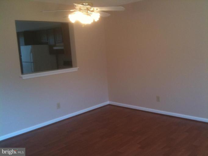 21673 Hazelnut Square, Unit 172 Sterling, VA 20164 - Photo 4 of 15 an empty room with a window