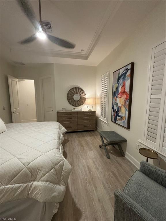 9571 Mussorie Court Naples, FL 34114 - Photo 13 of 26 a bedroom with furniture and a couch