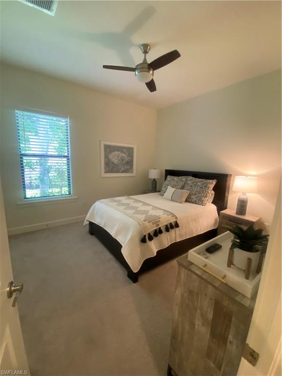 9571 Mussorie Court Naples, FL 34114 - Photo 16 of 26 a bedroom with a bed and window