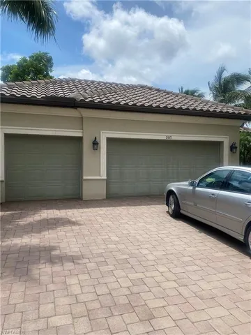 a car parked in front of a house