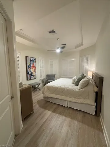 a bedroom with a bed and a couch