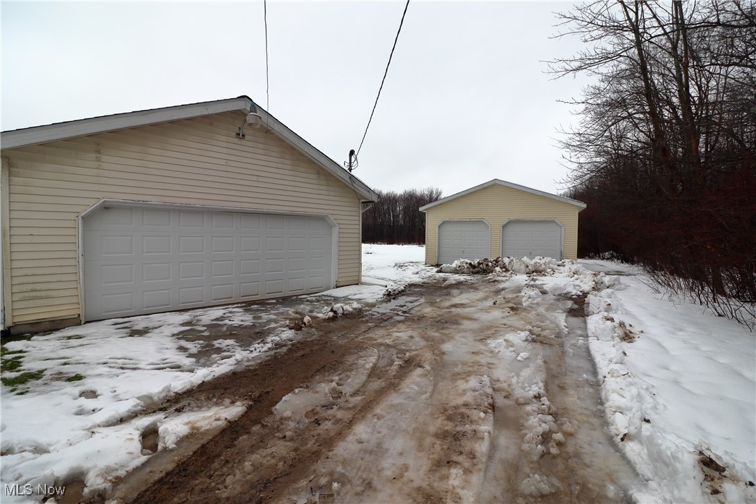 15286 Trask Road Thompson, OH 44086 - Photo 14 of 19 View of snow covered garage