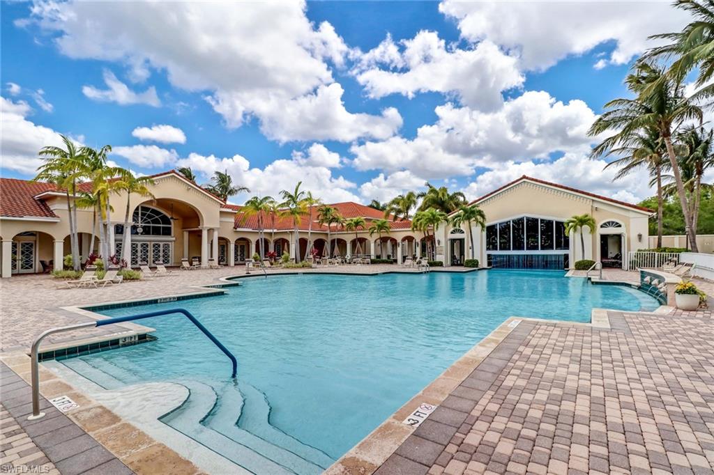 9158 Springview Loop Estero, FL 33928 - Photo 1 of 14 a front view of house with yard