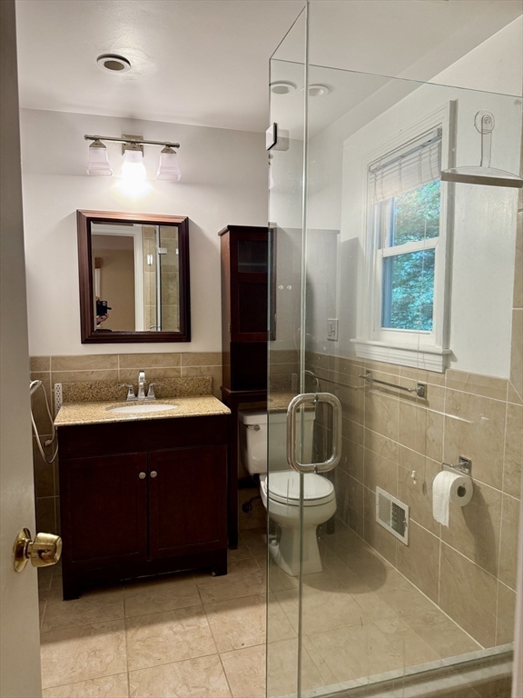 14 Lilac Circle Wellesley, MA 02482 - Photo 13 of 35 a bathroom with a sink and a mirror