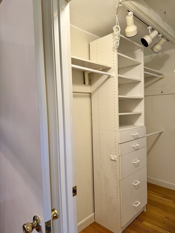 14 Lilac Circle Wellesley, MA 02482 - Photo 16 of 35 a view of walk in closet with empty racks
