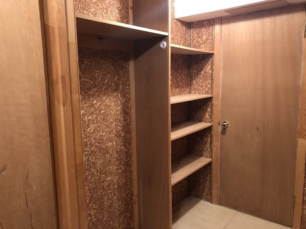 14 Lilac Circle Wellesley, MA 02482 - Photo 19 of 35 a view of an empty walk in closet