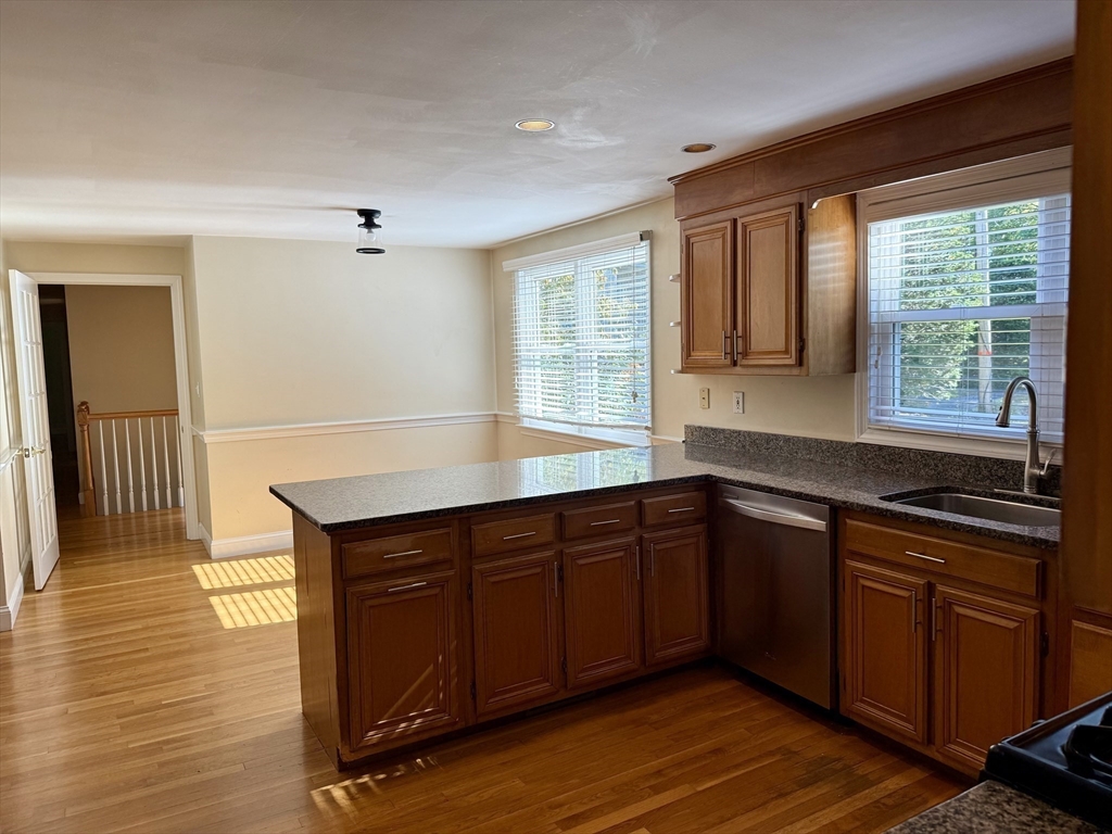 14 Lilac Circle Wellesley, MA 02482 - Photo 5 of 35 a kitchen with wooden cabinets and sink
