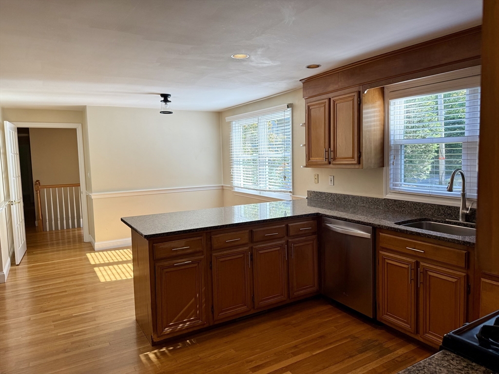 14 Lilac Circle Wellesley, MA 02482 - Photo 5 of 35 a kitchen with wooden cabinets and sink