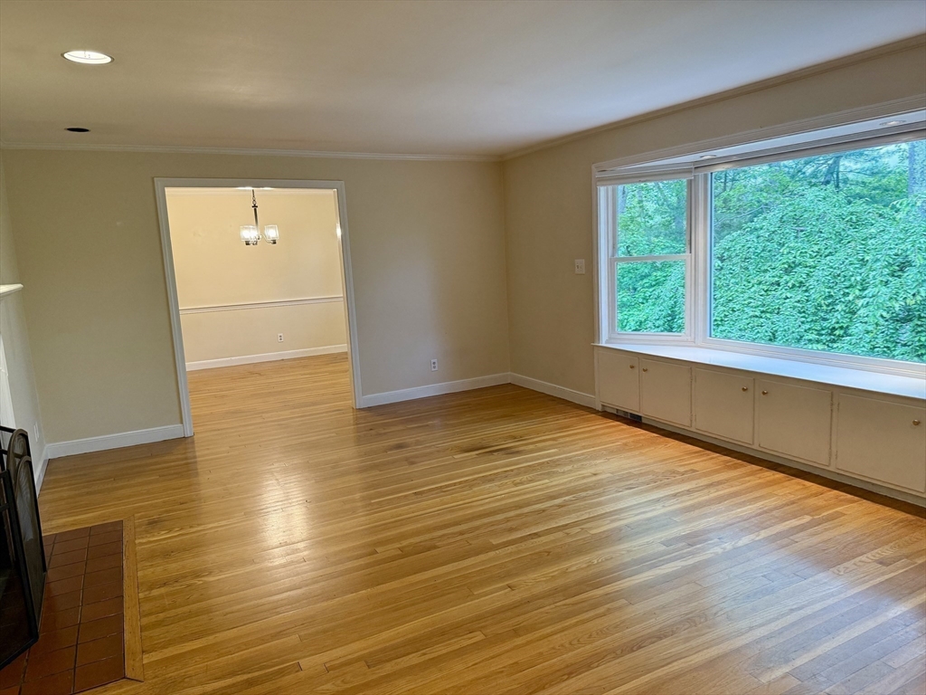 14 Lilac Circle Wellesley, MA 02482 - Photo 8 of 35 a view of an empty room with wooden floor and a window
