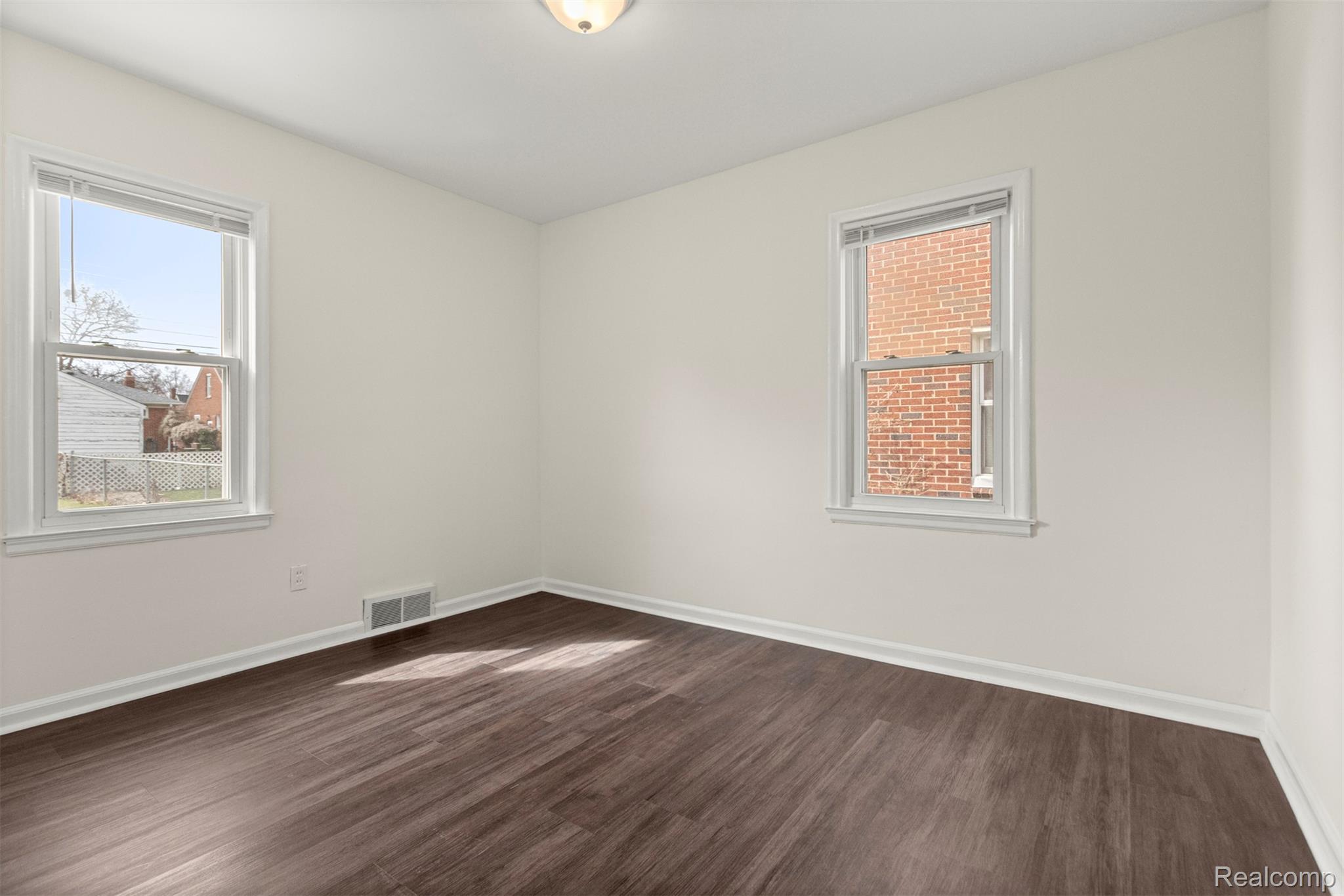 15705 Champaign Road Allen Park, MI 48101 - Photo 15 of 42 room with dark wood-type flooring