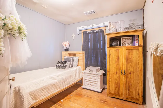 a bedroom with a bed and a closet