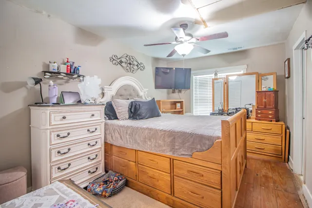 a spacious bathroom with a double vanity sink and a mirror