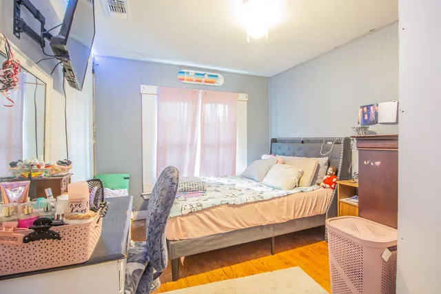 a bedroom with a bed and window