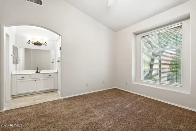 a bathroom with a sink mirror toilet and bathtub