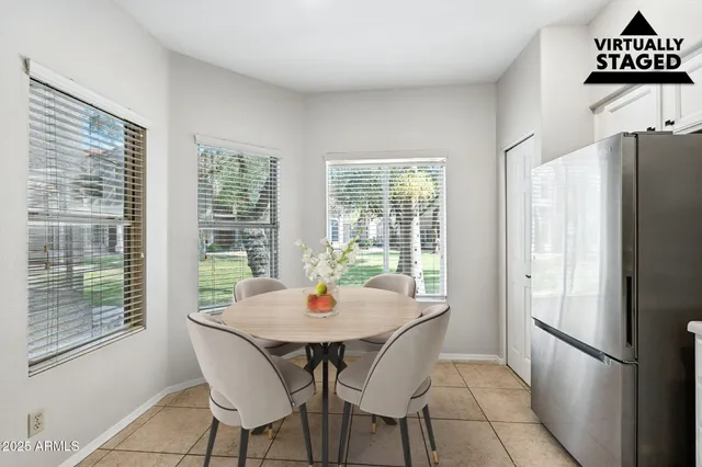 a view of a dining room with furniture window and outside view