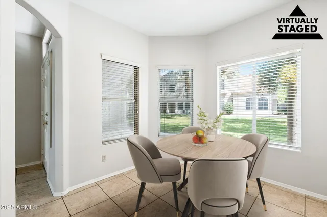 a view of a dining room with furniture window and outside view