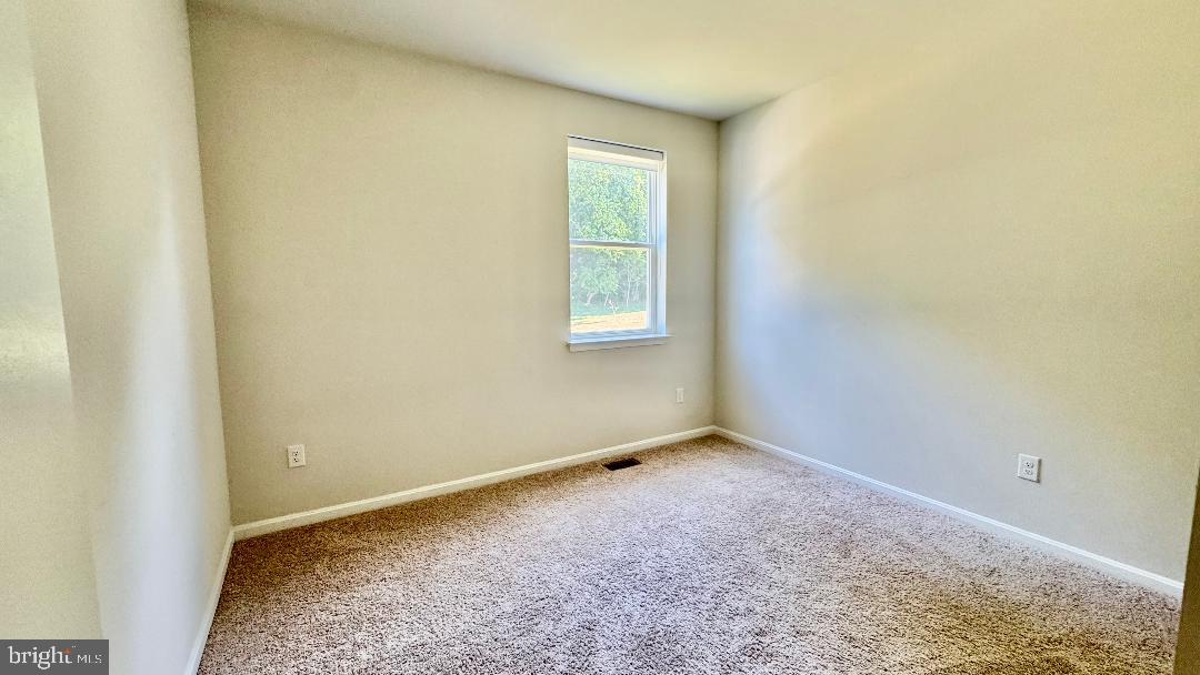 1236 Pimpernell Path Middletown, DE 19709 - Photo 8 of 37 an empty room with a window