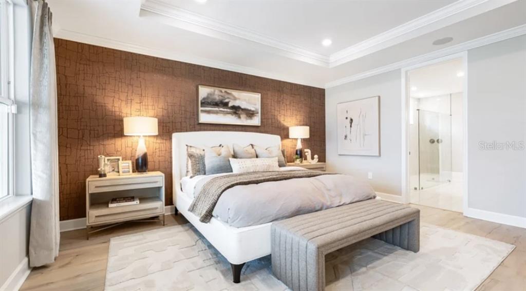 13618 Cornerstone Way Parrish, FL 34219 - Photo 12 of 27 a bedroom with a bed and a painting on the wall