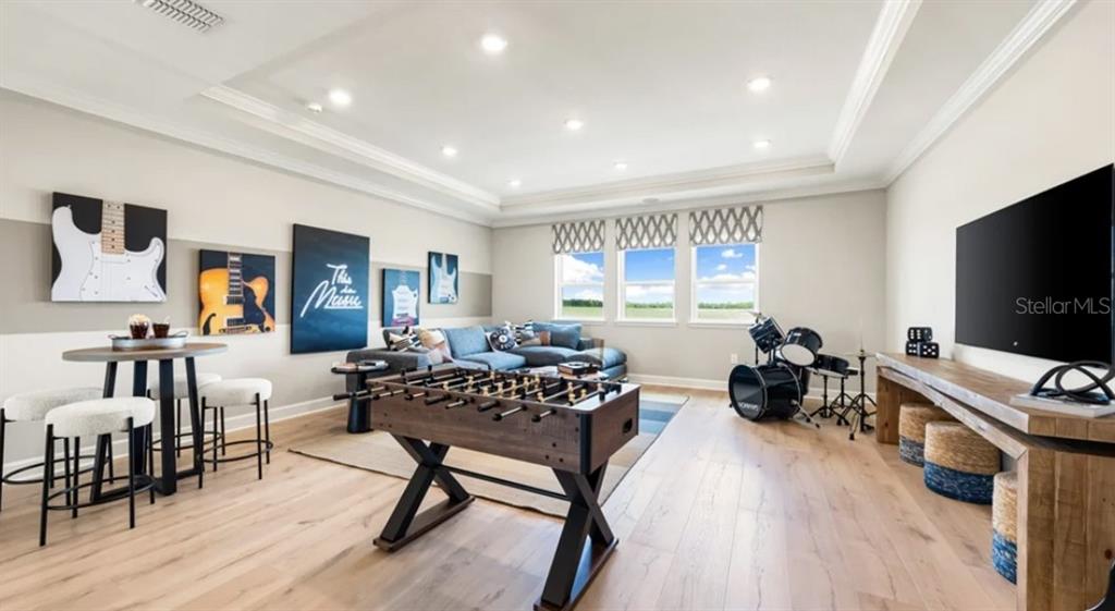 13618 Cornerstone Way Parrish, FL 34219 - Photo 14 of 27 a living room with furniture and a flat screen tv