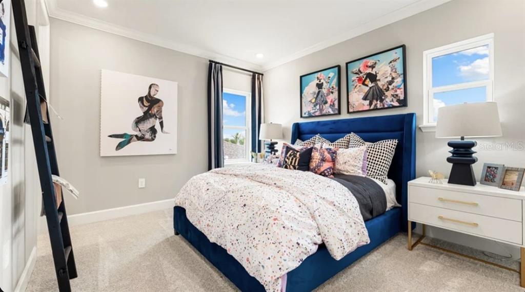 13618 Cornerstone Way Parrish, FL 34219 - Photo 15 of 27 a bedroom with bed and painting on the wall