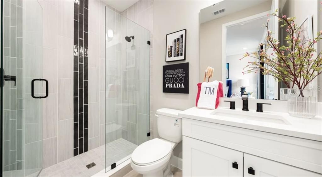 13618 Cornerstone Way Parrish, FL 34219 - Photo 16 of 27 a bathroom with a sink vanity mirror and toilet