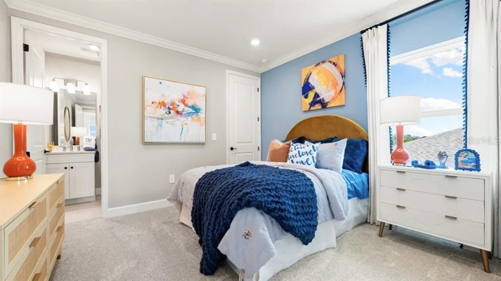 13618 Cornerstone Way Parrish, FL 34219 - Photo 17 of 27 a bedroom with a bed and dresser