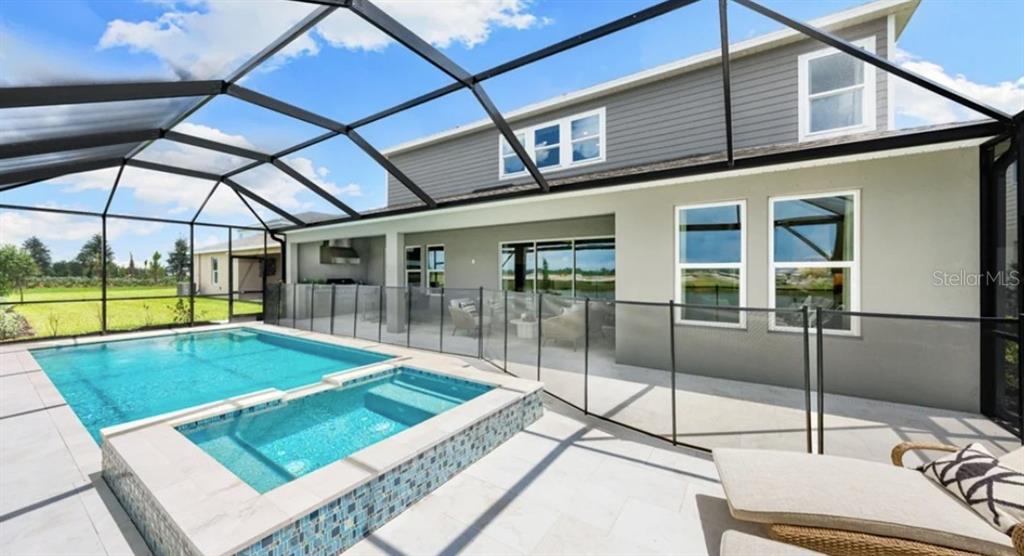 13618 Cornerstone Way Parrish, FL 34219 - Photo 22 of 27 a view of a patio with a table and chairs
