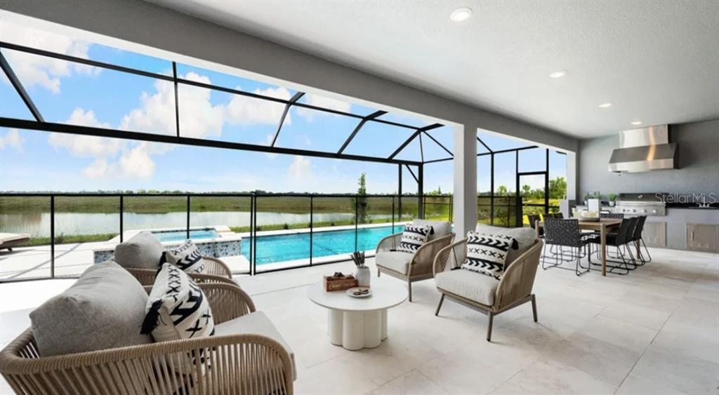 13618 Cornerstone Way Parrish, FL 34219 - Photo 4 of 27 a living room with furniture and a large window