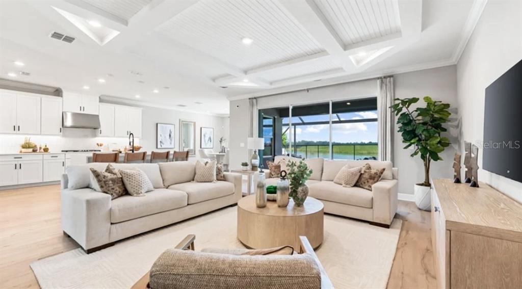 13618 Cornerstone Way Parrish, FL 34219 - Photo 5 of 27 a living room with furniture and a large window