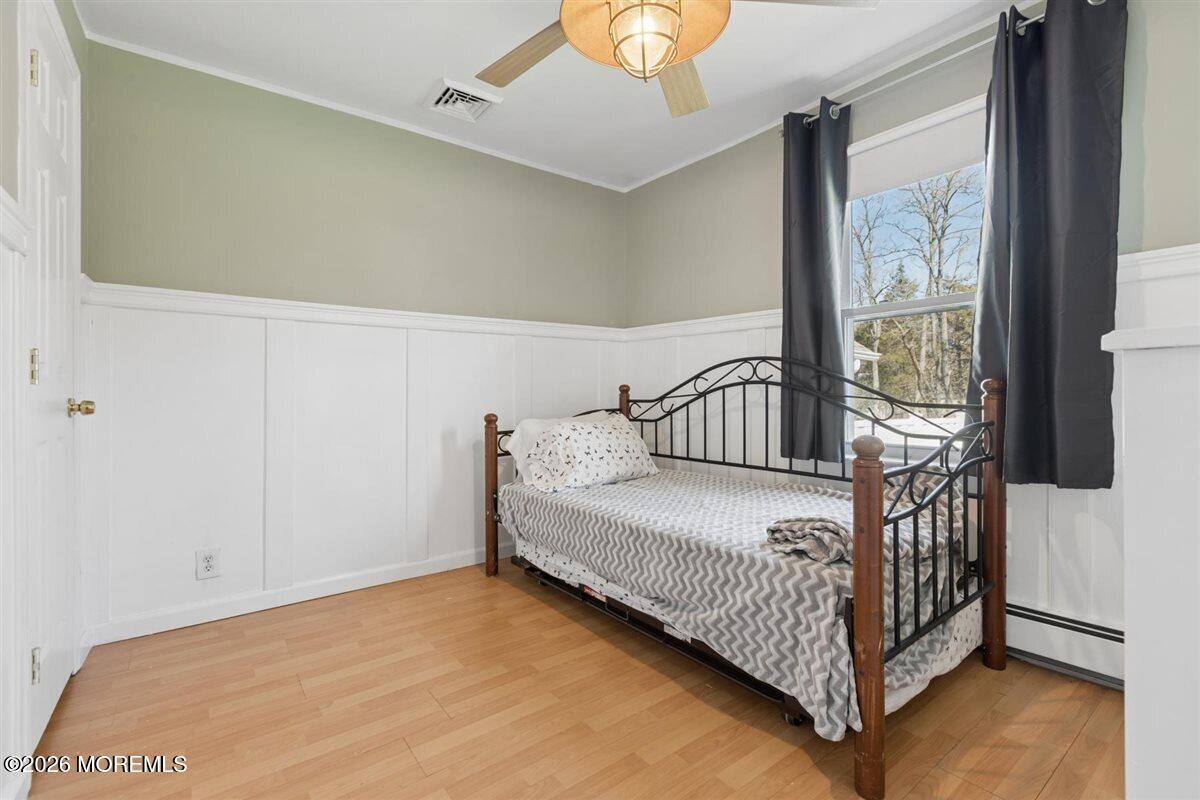 436 Cook Road Jackson, NJ 08527 - Photo 17 of 44 a bedroom with a bed and window