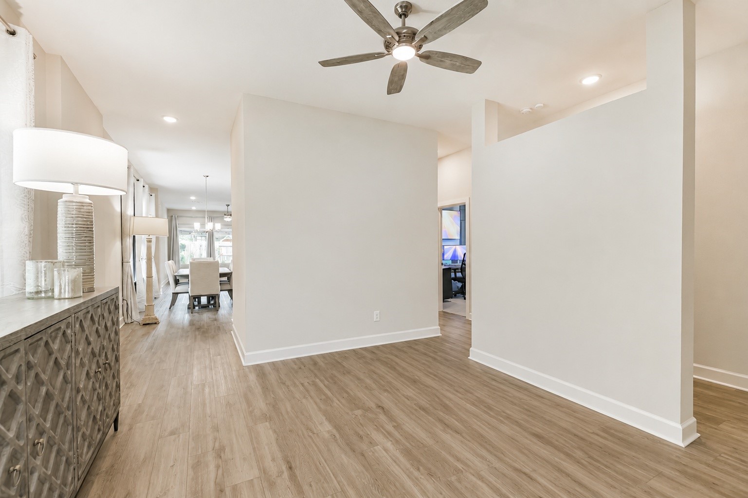 15611 Rising Wren Court Conroe, TX 77302 - Photo 7 of 38 a view of empty room with wooden floor