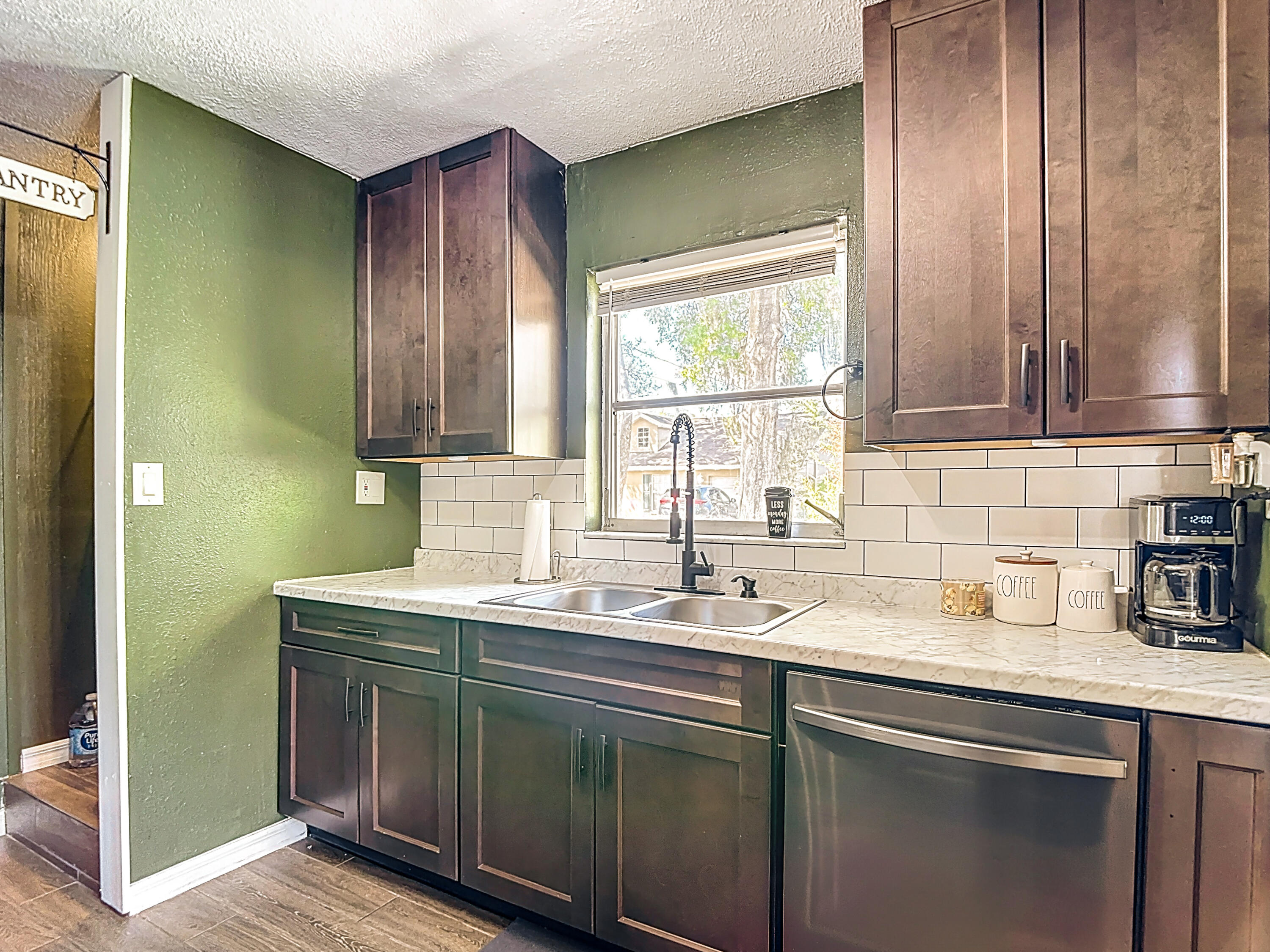 5335 Lemon Avenue Seffner, FL 33584 - Photo 11 of 34 a kitchen with a sink cabinets and a window