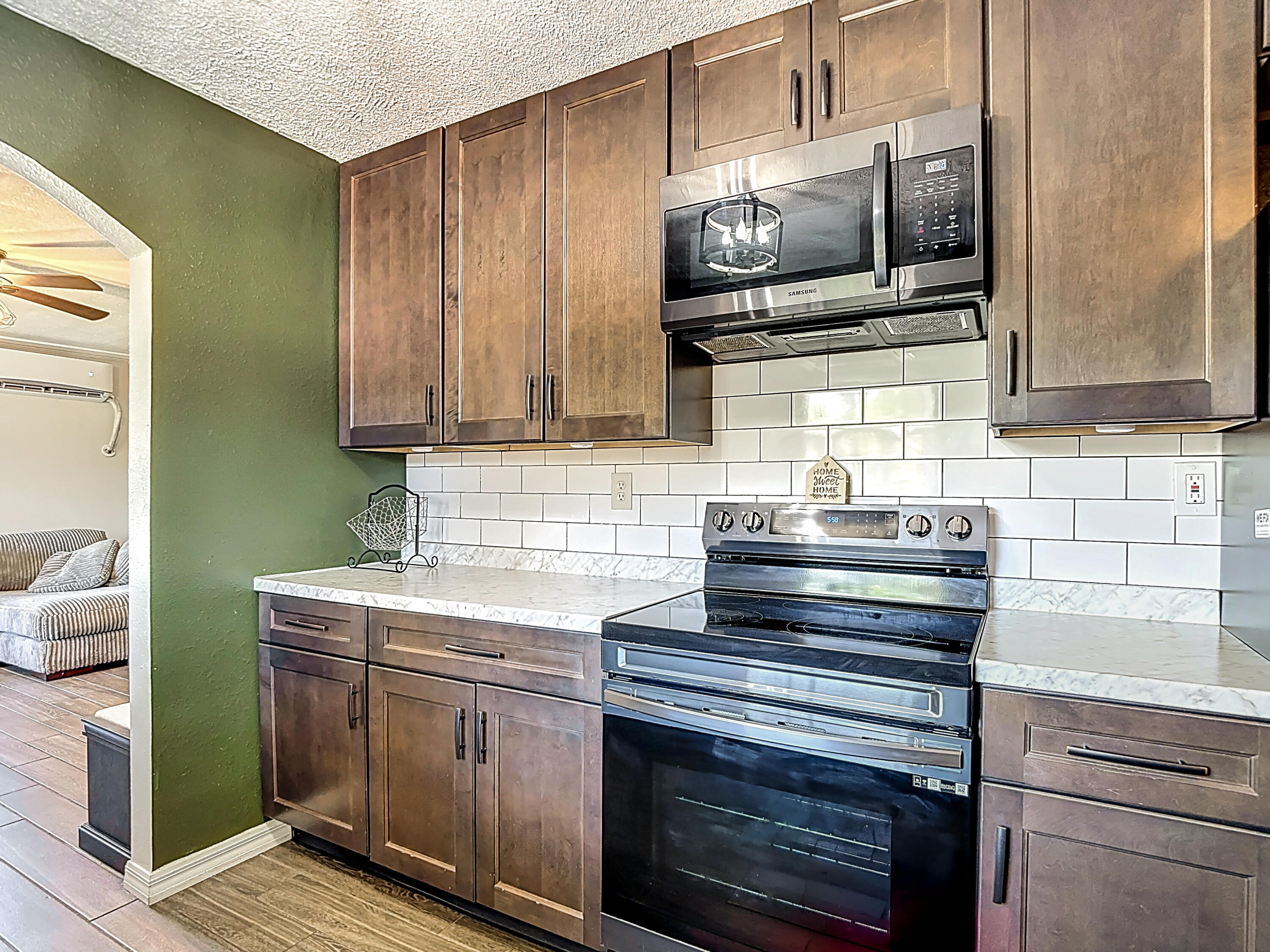 5335 Lemon Avenue Seffner, FL 33584 - Photo 12 of 34 a kitchen with a stove microwave and sink