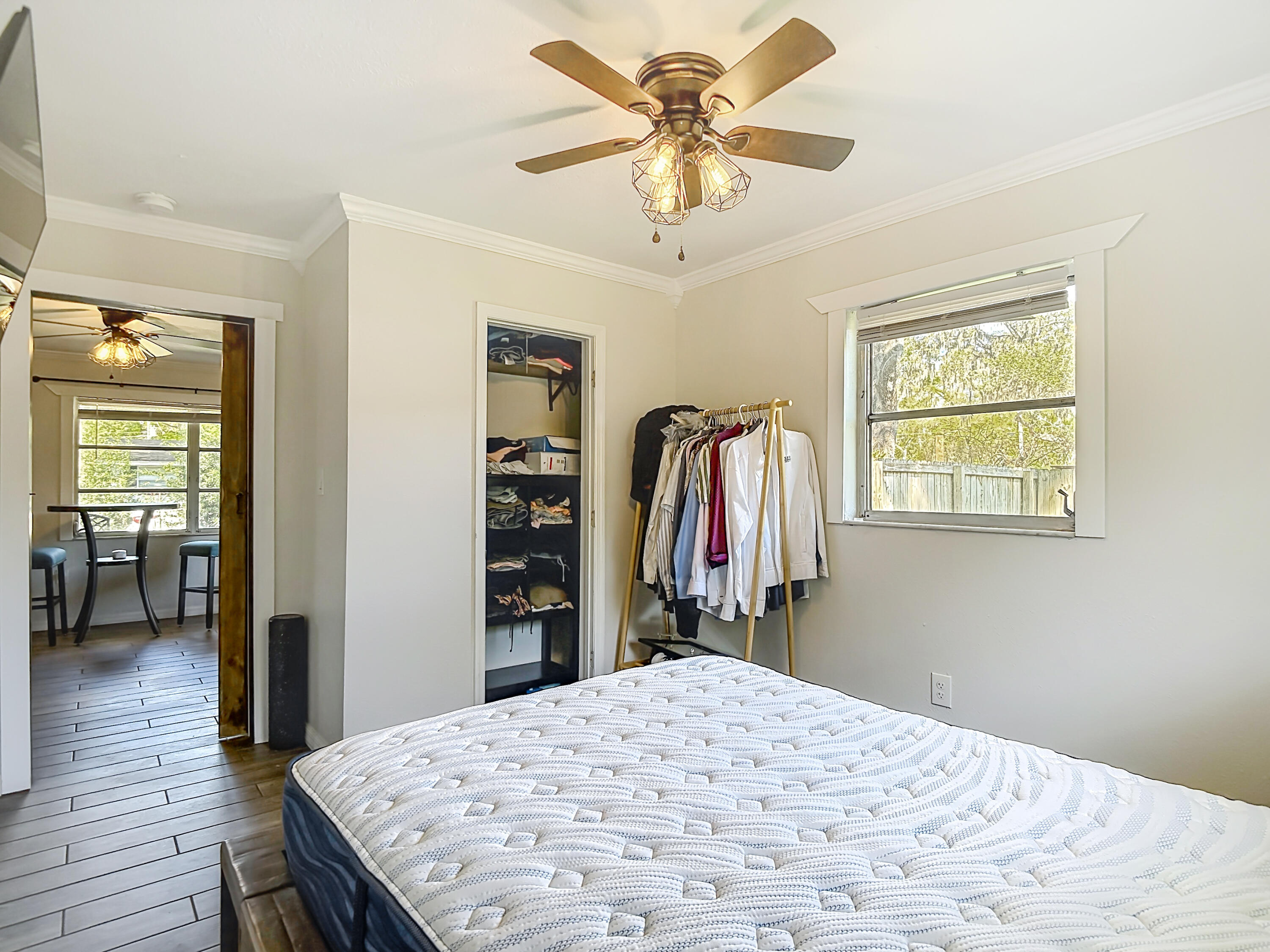 5335 Lemon Avenue Seffner, FL 33584 - Photo 15 of 34 a bedroom with a bed and a chandelier