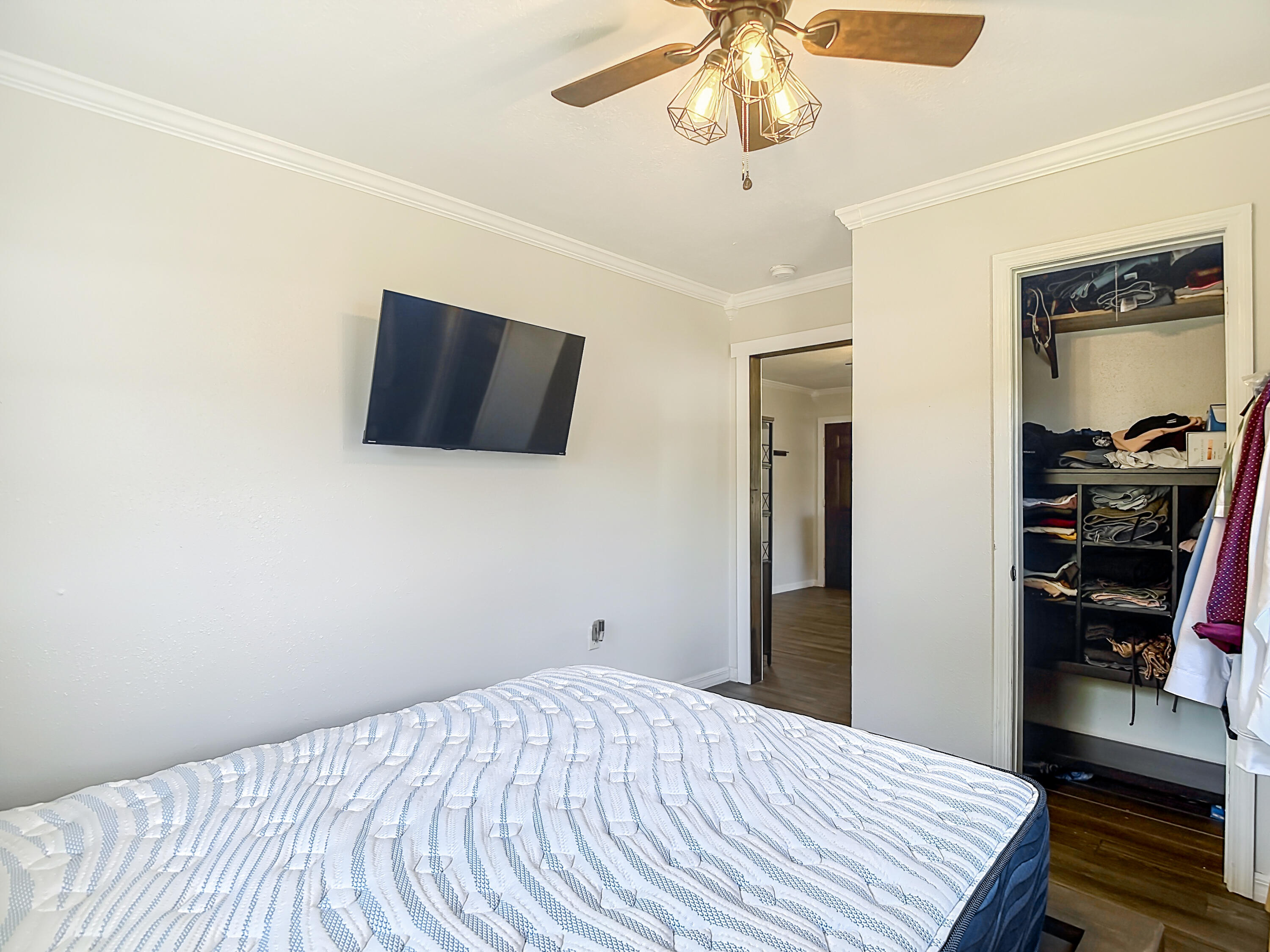 5335 Lemon Avenue Seffner, FL 33584 - Photo 18 of 34 a bedroom with a bed and a flat tv screen on a dresser